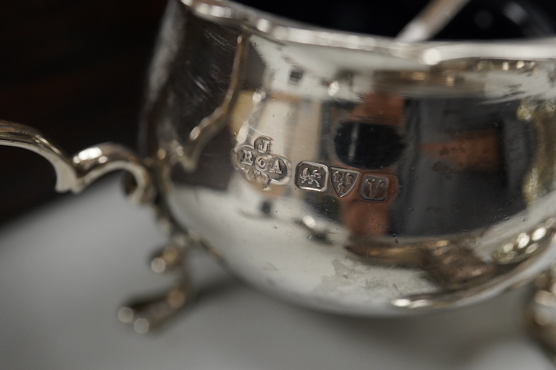 Three assorted 20th century silver napkin rings, a George V silver mustard pot and pepperette, a set of six late Victorian silver coffee spoons, London, 1883, and six other silver items.